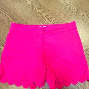 Hot pink shorts.